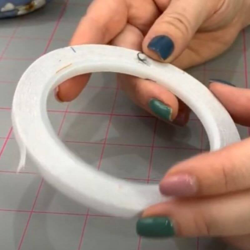 Sewing double-sided tape that is white in colour.